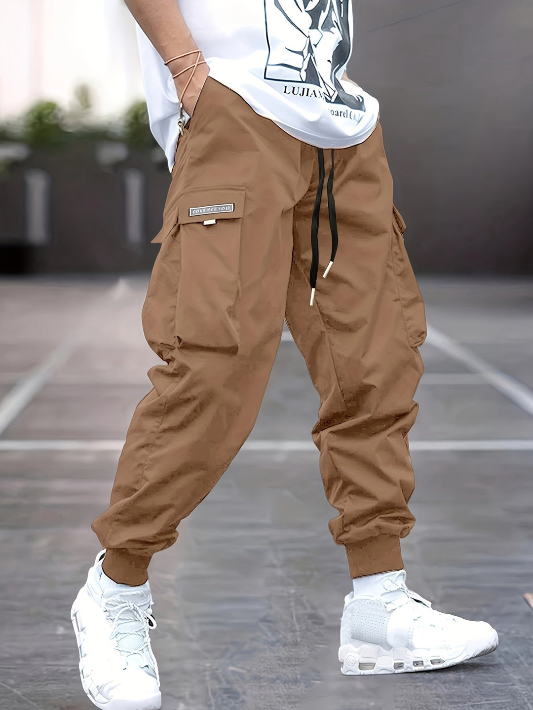 Stylish men's versatile cargo pants featuring a drawstring, relaxed fit, and multi-pockets, ideal for casual use.