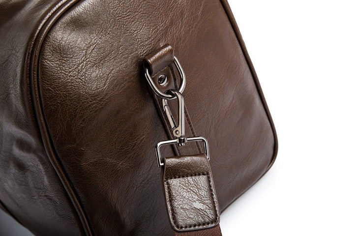 Brown leather weekender duffel, spacious and easy to carry.