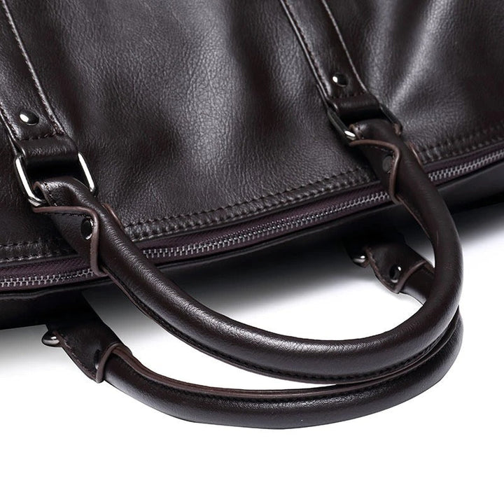 Black leather weekender bag, a durable and stylish travel option.