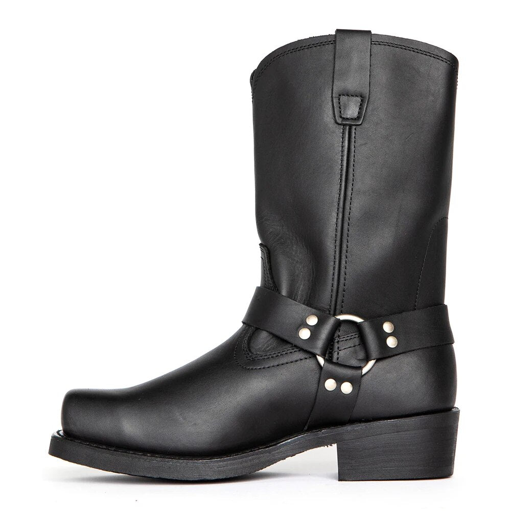 Close-up of men's brown leather harness cowboy boots, showcasing intricate western detailing.