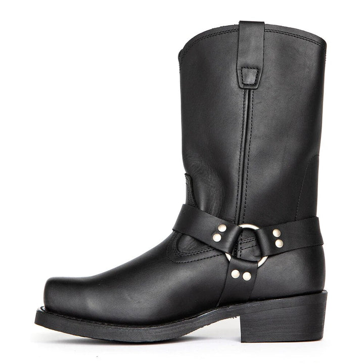 Close-up of men's brown leather harness cowboy boots, showcasing intricate western detailing.