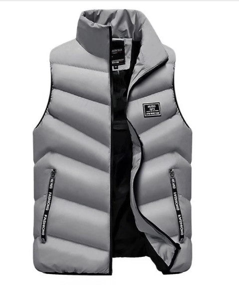 Man wearing a sleek, lightweight puffer vest. Perfect for active layering and casual warmth.