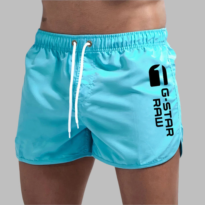 Men's quick dry swim trunks, ideal for beach and pool.