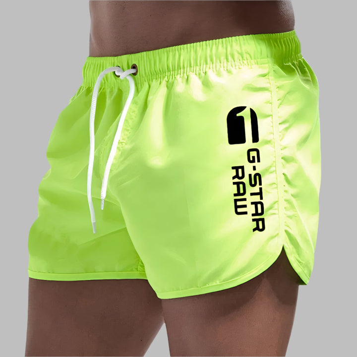 Athletic men's shorts perfect for summer poolside wear.