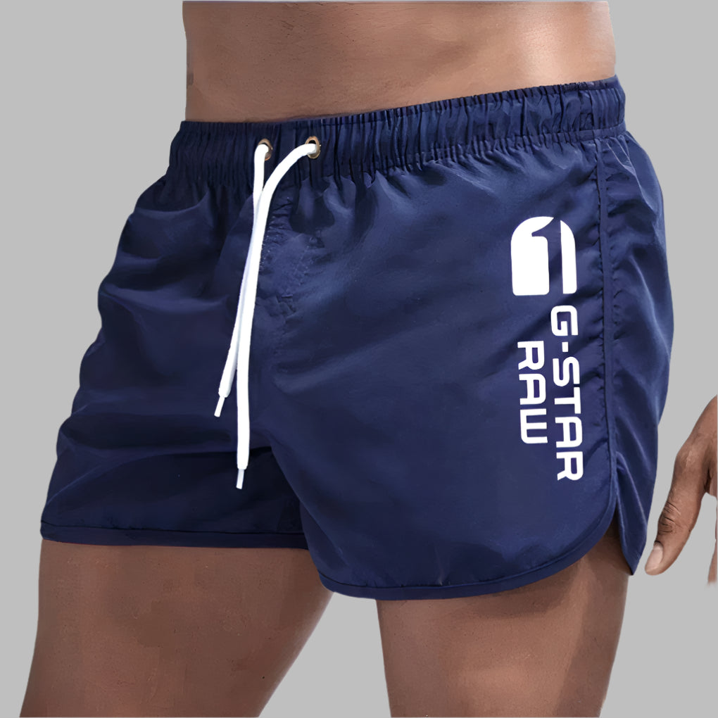 Comfortable men's beachwear featuring quick dry swim trunks.