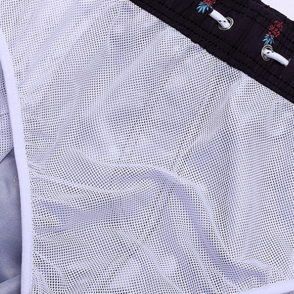 Lightweight quick-dry shorts for men, featuring a vibrant pattern for beachwear.