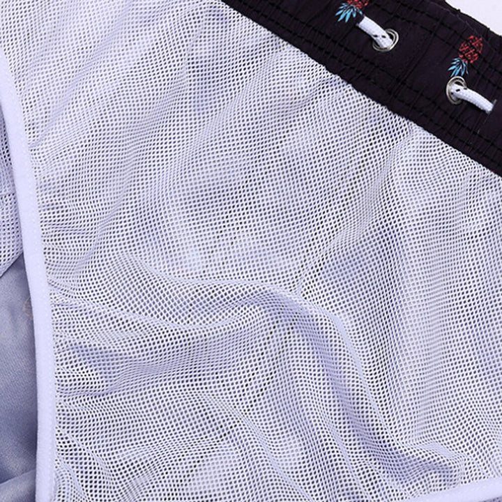 Lightweight quick-dry shorts for men, featuring a vibrant pattern for beachwear.