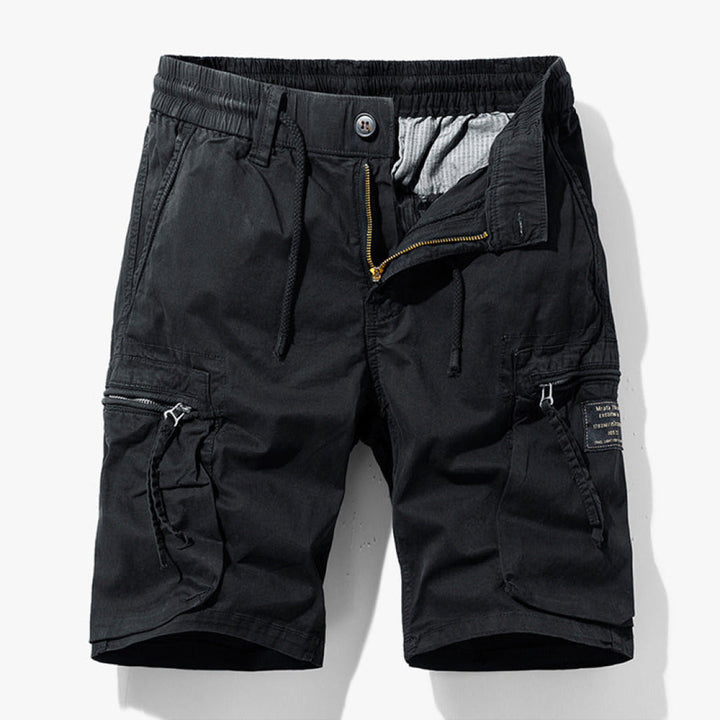Army green men's relaxed fit cargo shorts, perfect for outdoor adventures. Knee-length utility shorts with multiple pockets.