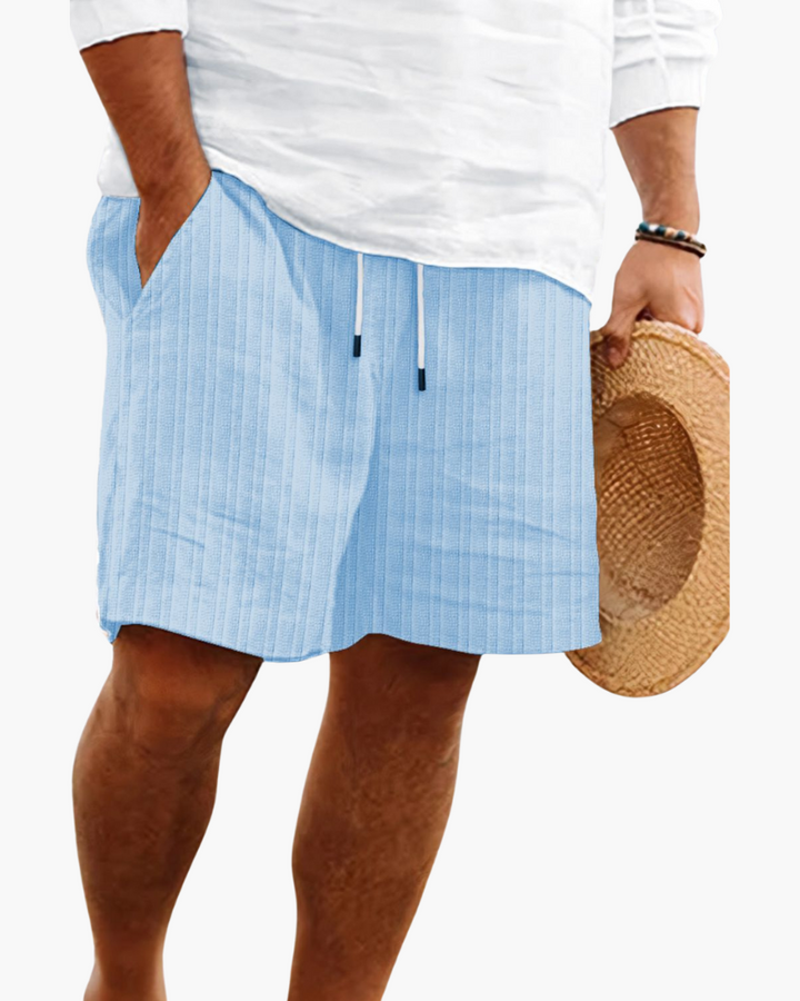 Model wearing men's comfortable relaxed fit drawstring shorts, showcasing casual summer style.