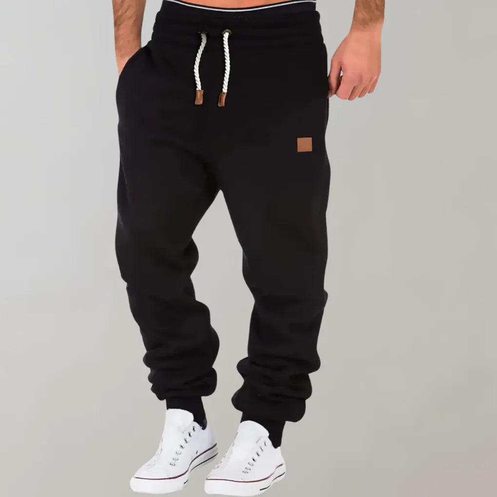 Versatile men's everyday pants: relaxed fit joggers with tapered leg and cuffed ankles.