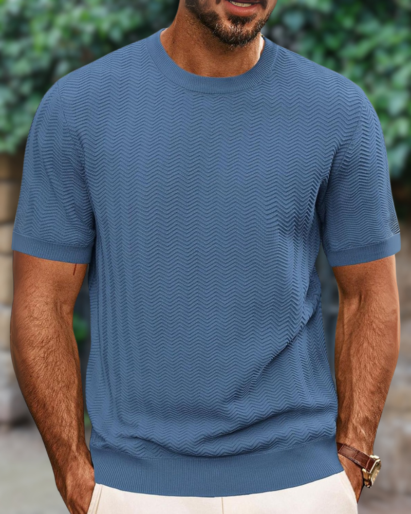 Close-up of the textured knit fabric on a men's basic round neck tee.