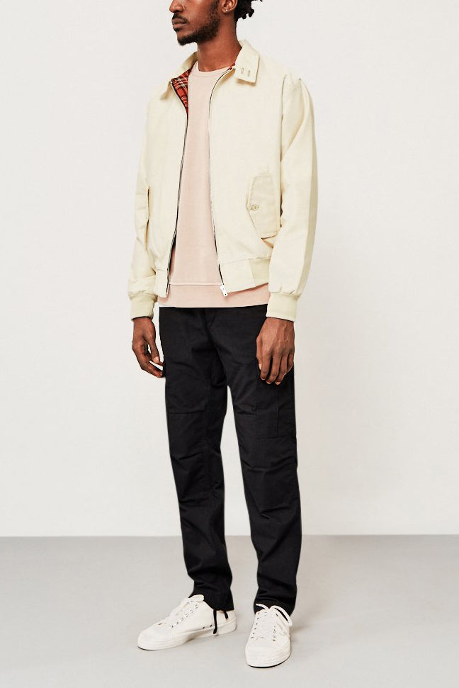 Model showcasing the stylish outerwear of a men's Harrington jacket