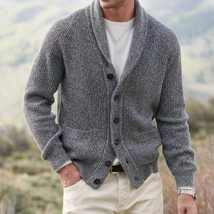 Detail shot: ribbed cuffs and hem of men's shawl collar cardigan