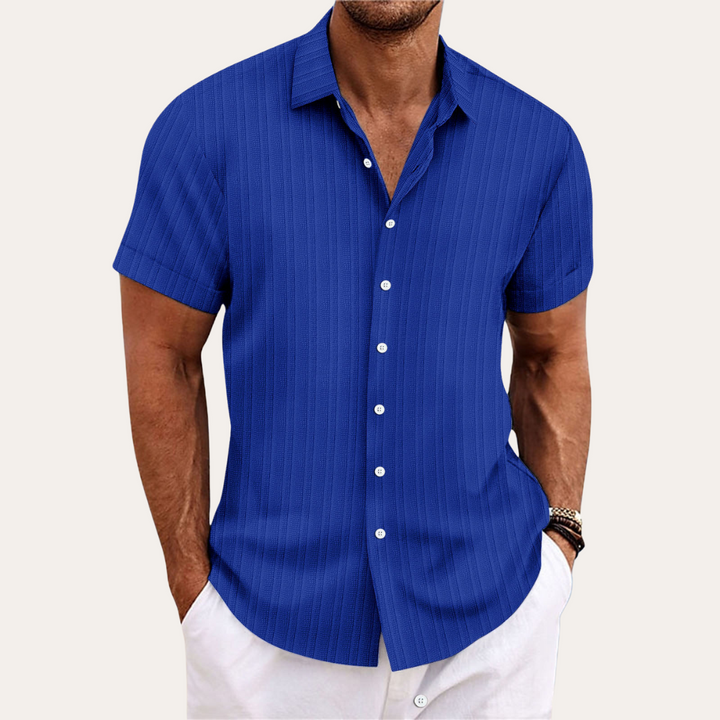 Stylish men's short sleeve button-down shirt with vertical stripes, ideal for casual summer outfits.
