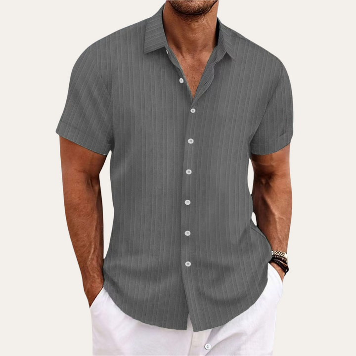Classic men's striped short sleeve button-down shirt. Essential summer fashion for a smart casual look.