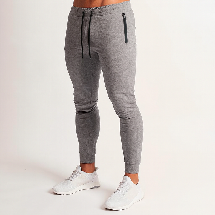 Pair of black slim fit joggers for men, emphasizing comfortable, everyday wear.