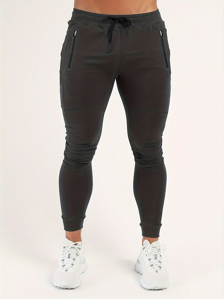 Close-up of the textured polyester fabric of these men's slim fit joggers.