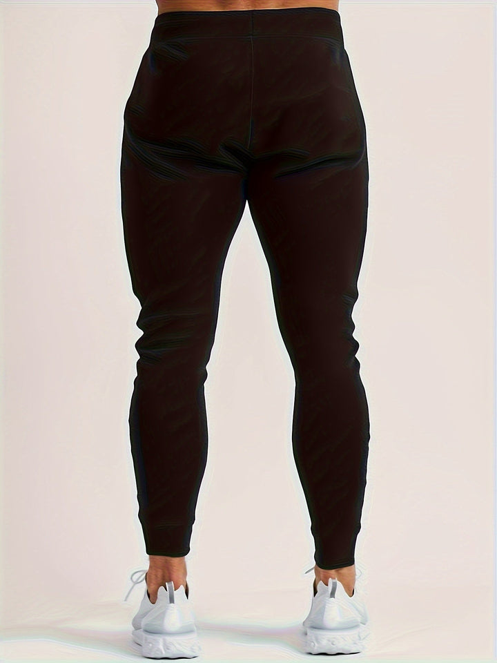 Dynamic shot of a man in motion wearing slim fit casual joggers.