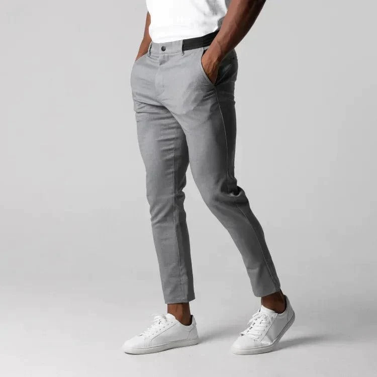 Front view of stylish menswear: men's slim fit stretch chinos in navy blue.
