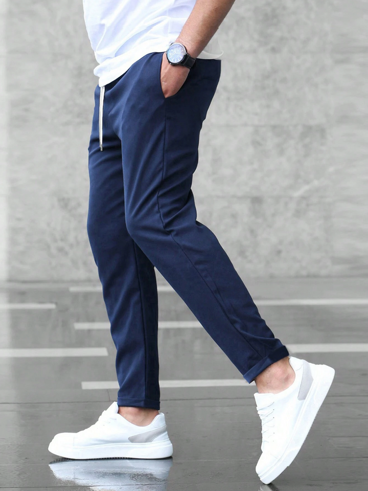 Comfortable men's slim-fit trousers designed for stylish work and casual outfits.