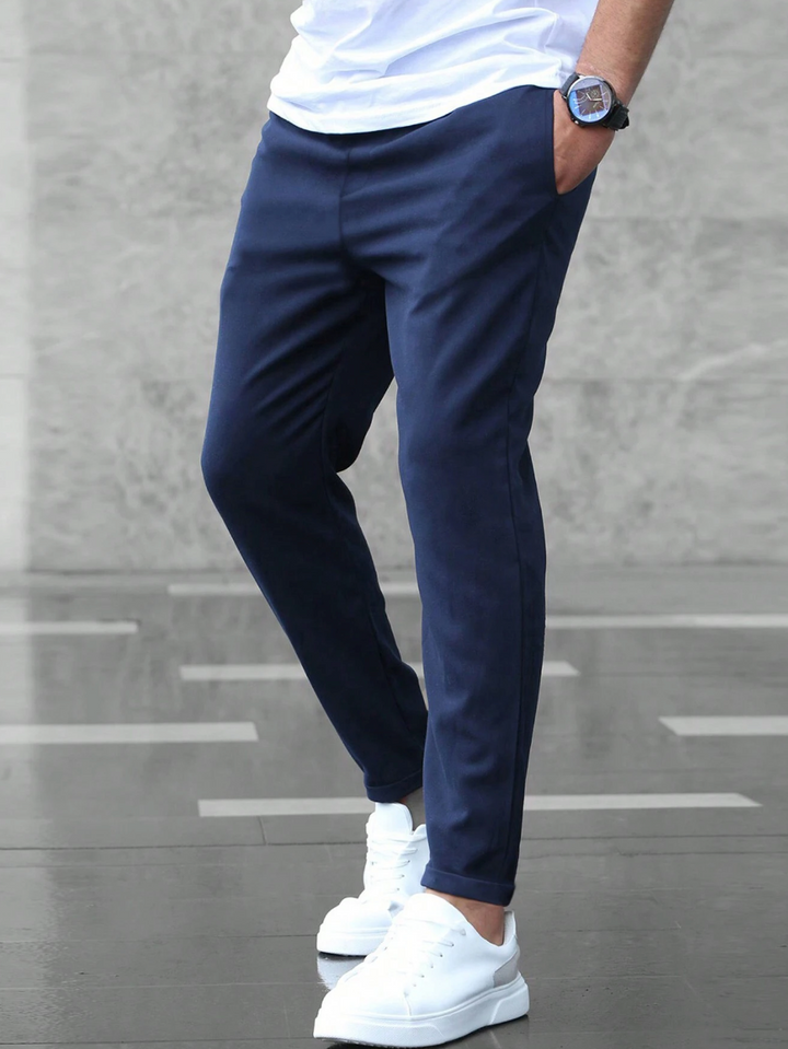 Modern men's slim-fit stretch pants offering ultimate comfort for work & casual settings.