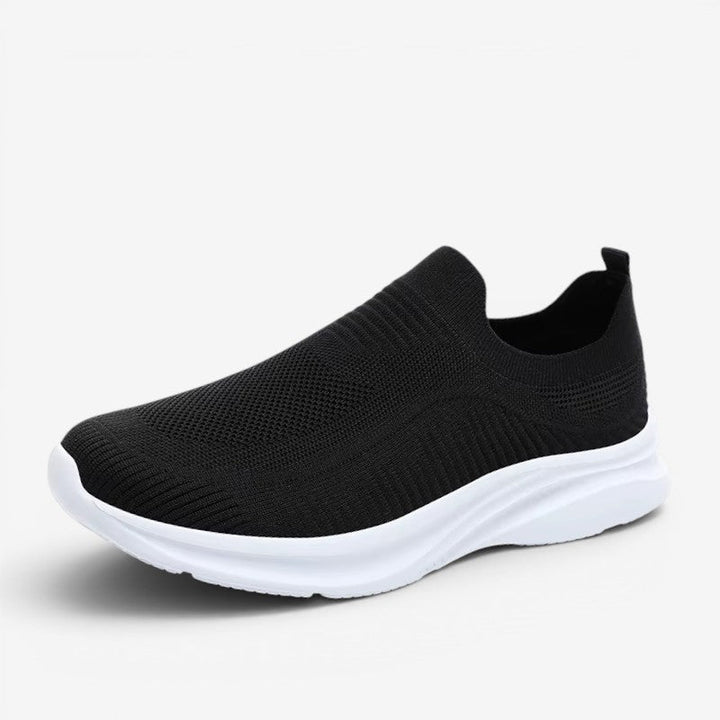 Lightweight men's slip-on sneakers in a versatile style, perfect for travel & easy wear.