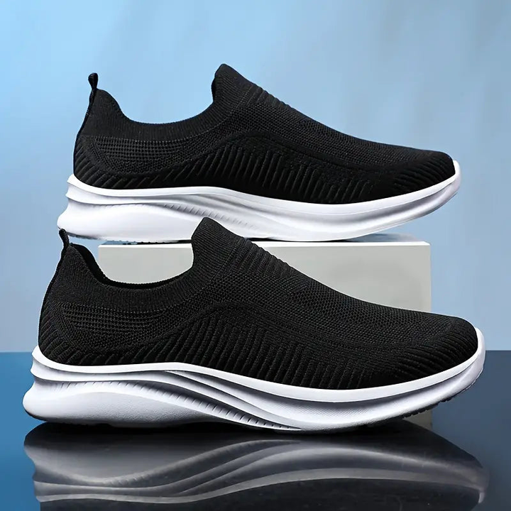 Comfortable men's casual slip-on walking shoes with a sleek design for everyday versatility.