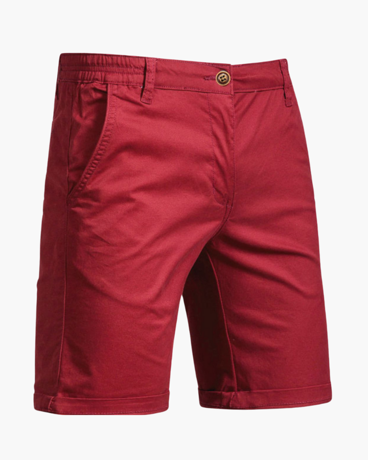 Detail of the button and zipper on men's smart casual chino shorts.