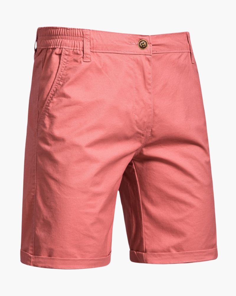 Stack of men's versatile chino shorts in various colors for warm weather.