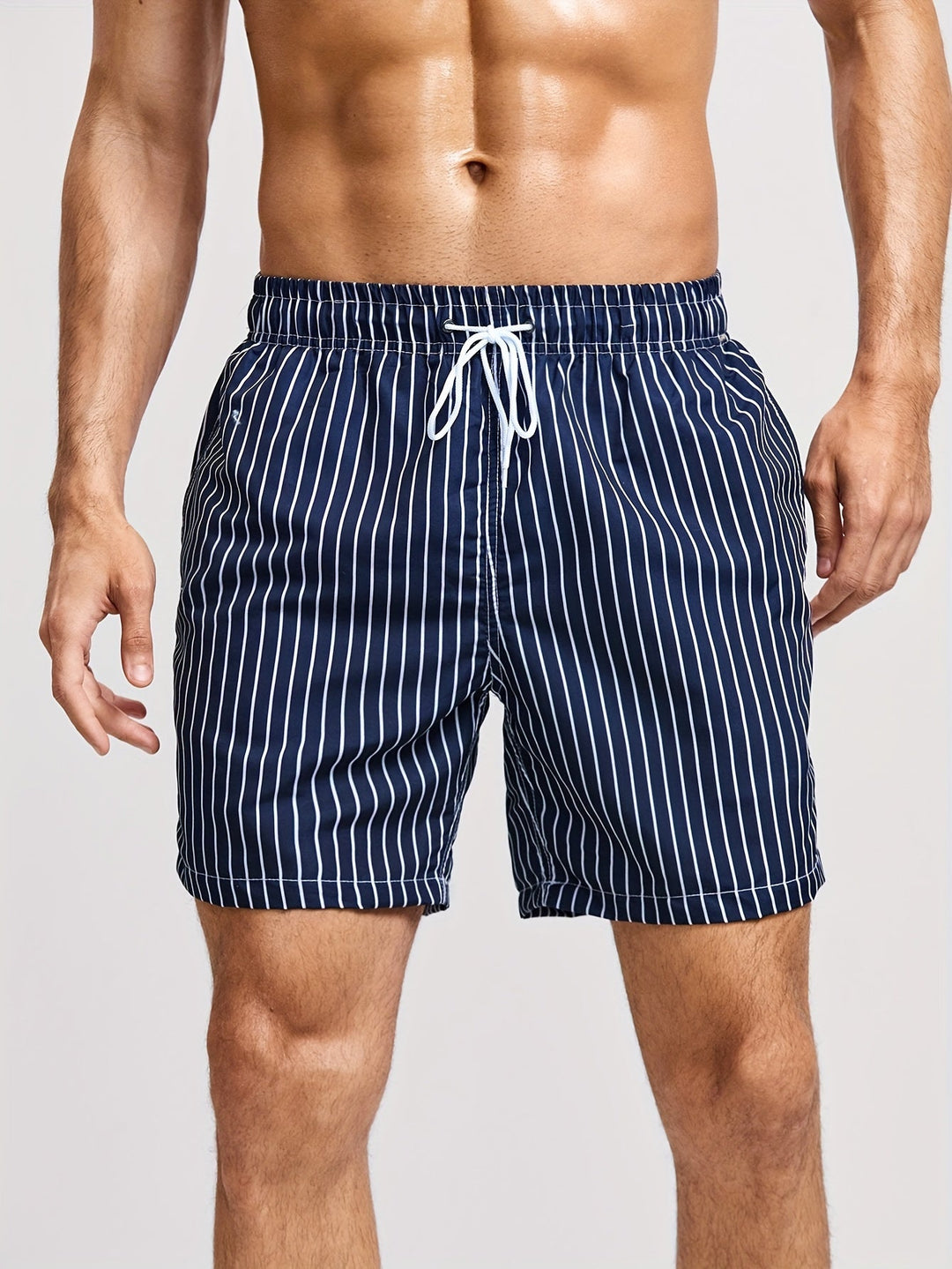 Close-up of the drawstring and waistband on men's striped shorts