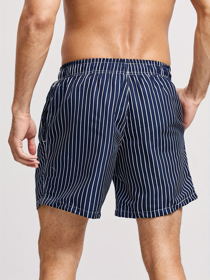 Model wearing men's casual striped shorts for summer beachwear