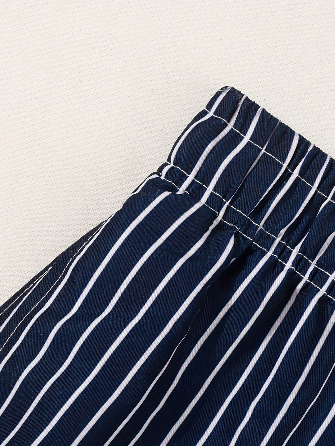 Side view of men's athletic-fit striped drawstring shorts