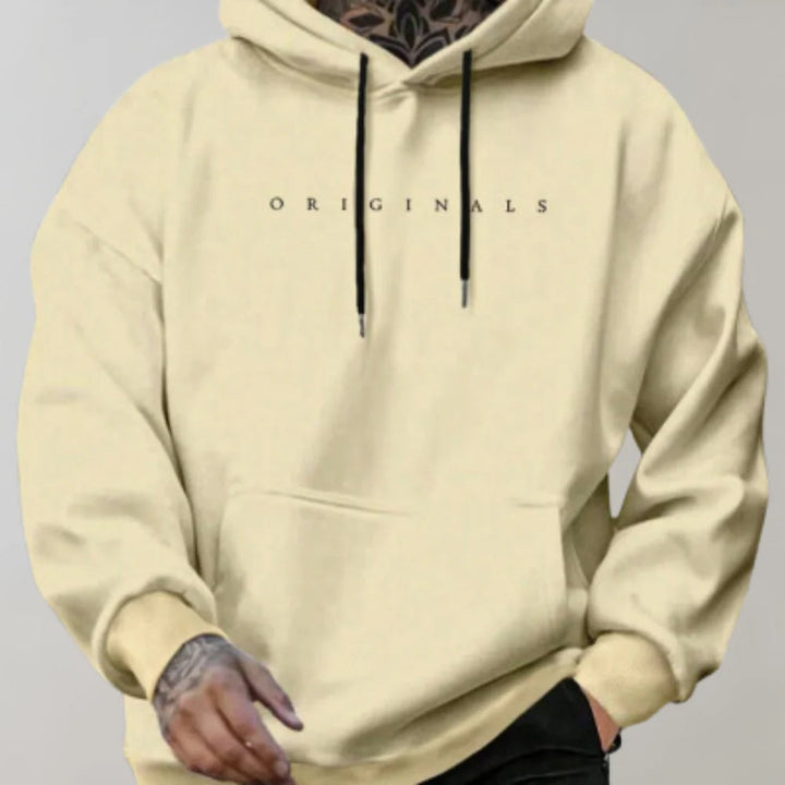 Men's stylish oversized grey hoodie with an adjustable hood, perfect for casual streetwear & comfort.
