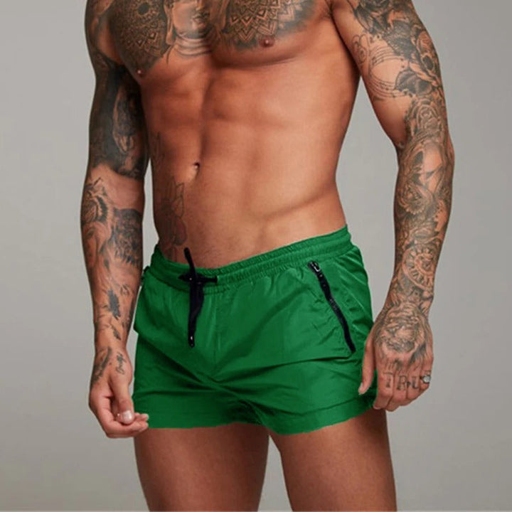 Quick-dry men's swimwear shorts, ideal for beachwear, swimming, and stylish poolside fashion.