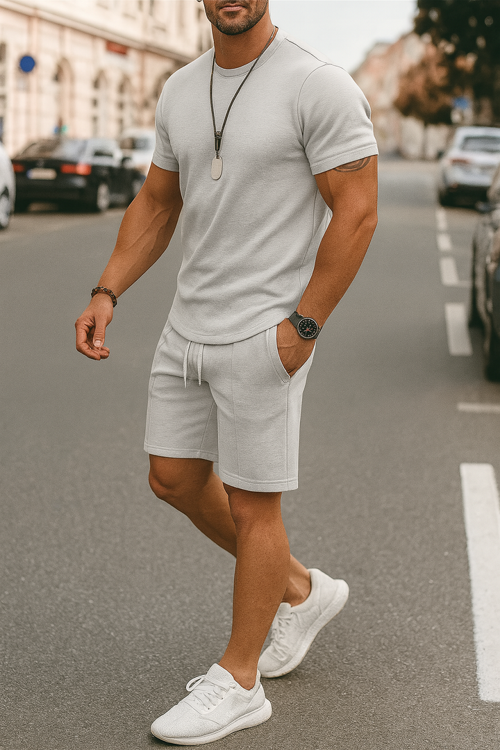 Casual men's summer set featuring a graphic t-shirt and comfortable shorts.