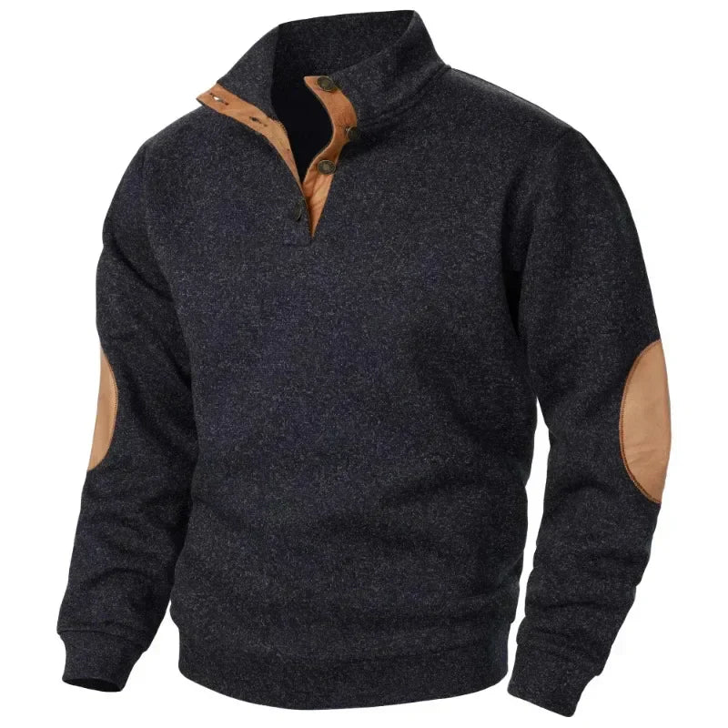 Model showing off the relaxed fit of a men's V-neck sweatshirt outdoors.