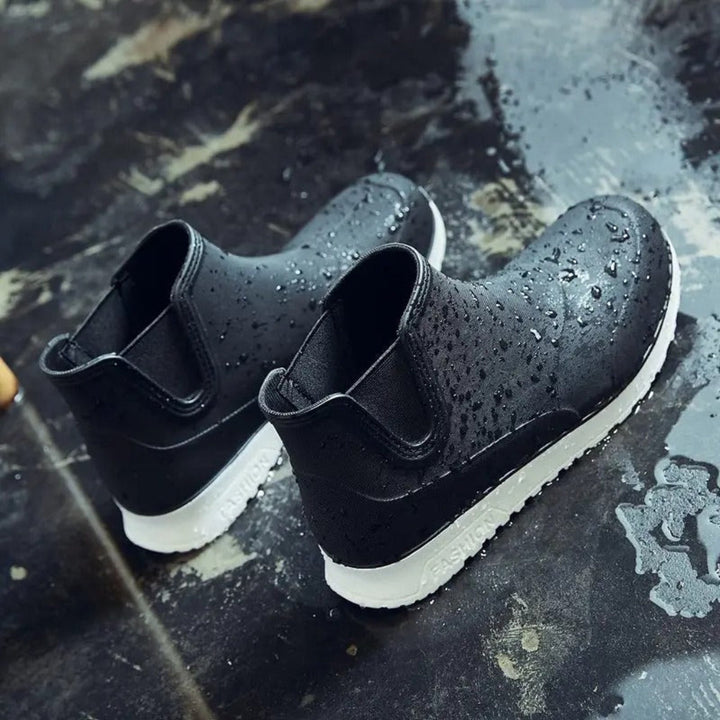 Durable men's all-weather slip-on rubber boots, ideal for rainy or muddy conditions