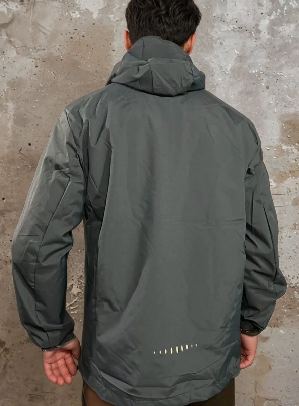 Lightweight men's hooded rain jacket with full zip & practical pockets, perfect for travel & activewear.