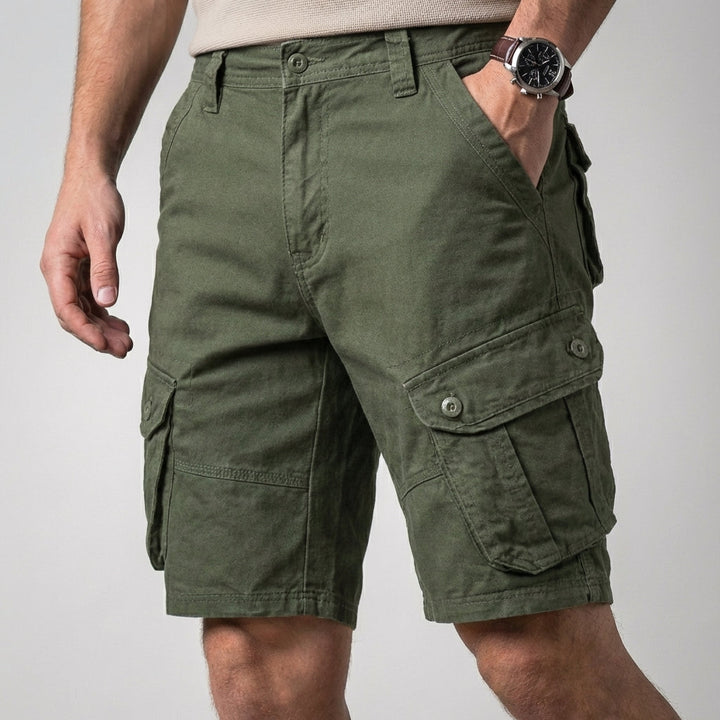 Durable men's relaxed fit cargo shorts with multiple secure flap pockets, knee-length design, perfect for utility.