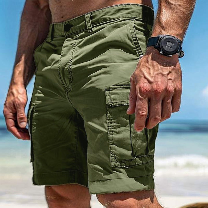 Model wearing men's relaxed fit cargo shorts, perfect for casual summer style and outdoor utility.