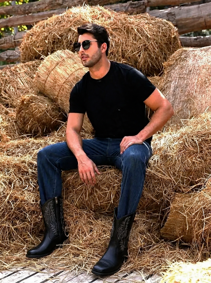 Rugged men's cowboy boots, tall western riding style. Features pointed toe and classic pull-on design.