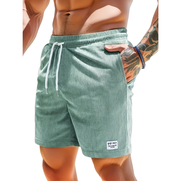 Folded men's elastic waist swim shorts, ready for easy packing for your next vacation.