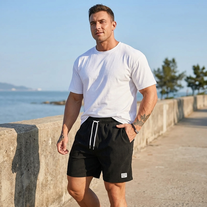 Detail shot of the elastic waist & drawstring on men's comfortable pool and beach shorts.