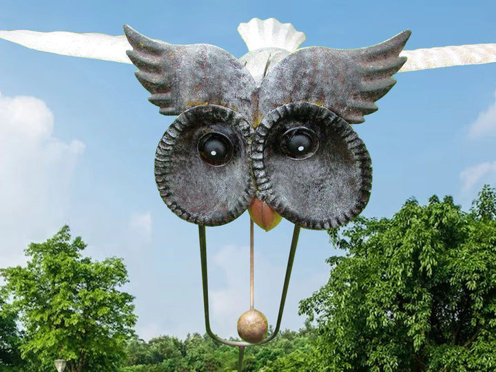 Decorative outdoor metal art: a garden windmill sculpture with motion.