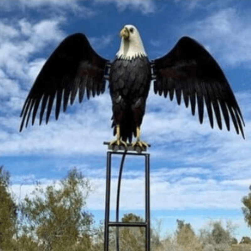 Enhance your garden with this metal windmill, a unique lawn ornament.