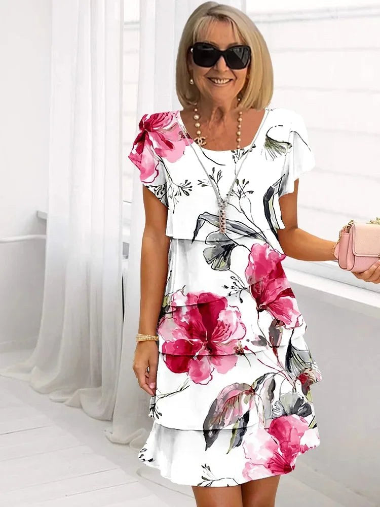 Elegant women's ruffled floral pleated dress, perfect for summer parties & occasionwear. Flattering design.