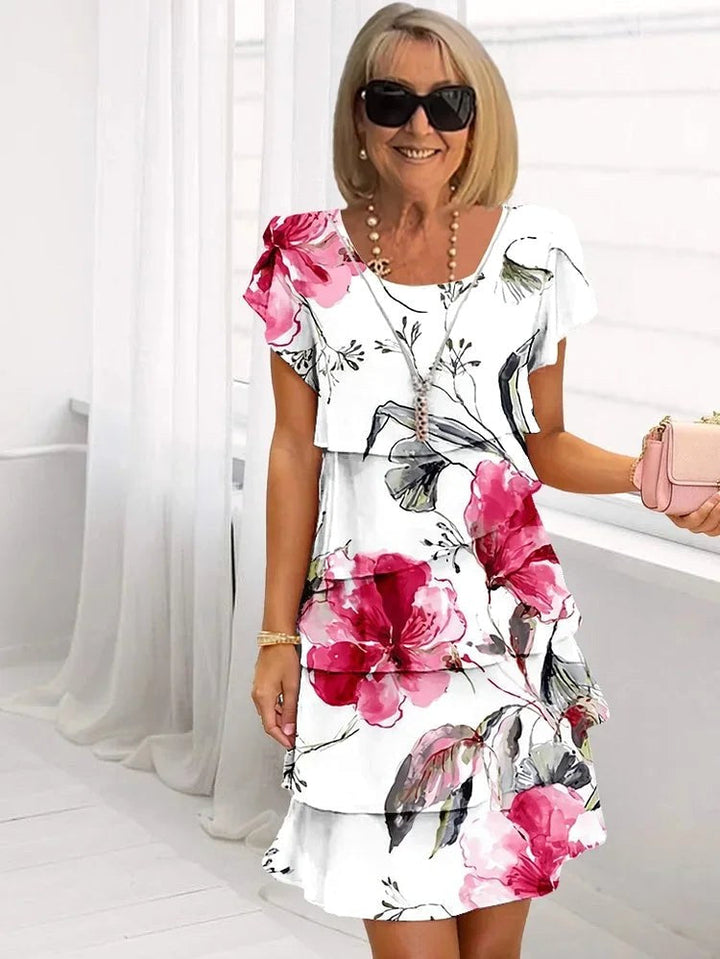 Elegant women's ruffled floral pleated dress, perfect for summer parties & occasionwear. Flattering design.