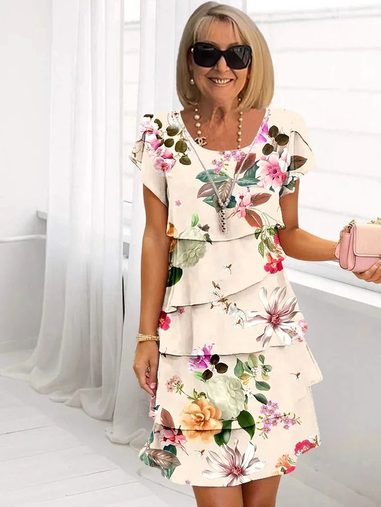 Gorgeous women's ruffled floral pleated dress, a flattering choice for any summer occasion or elegant party.