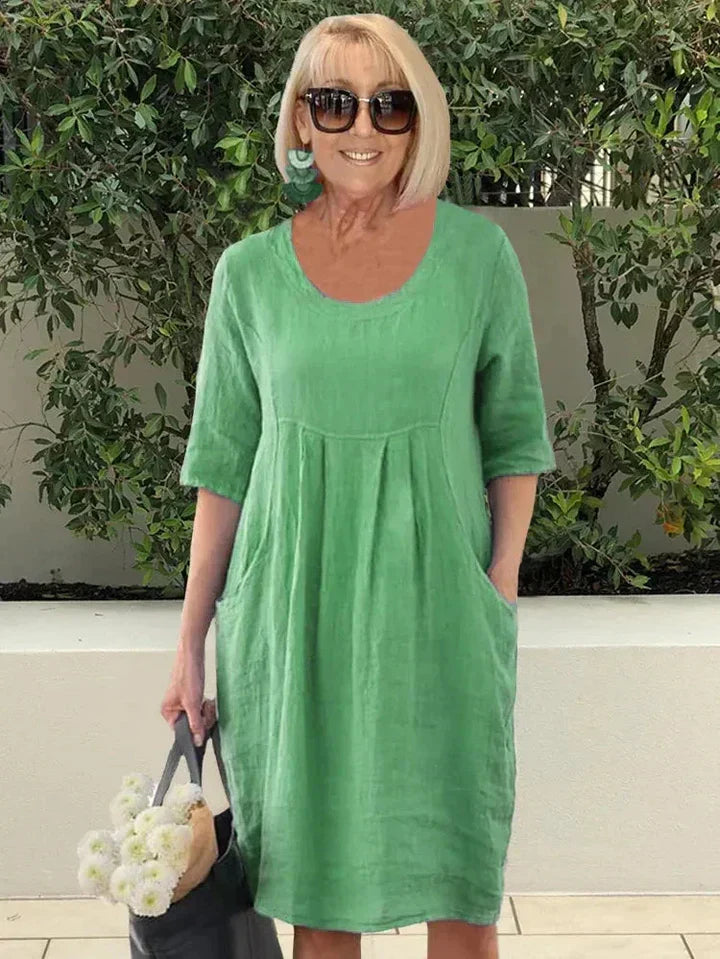 Everyday women's midi dress: comfortable, relaxed fit, half sleeve, elegant, with pockets for casual style.