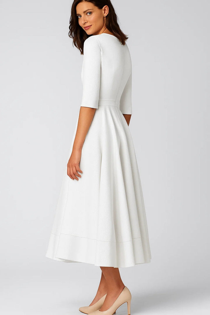 Women's formal white V-neck midi cocktail dress. Elegant fit-and-flare design, ideal for special events.